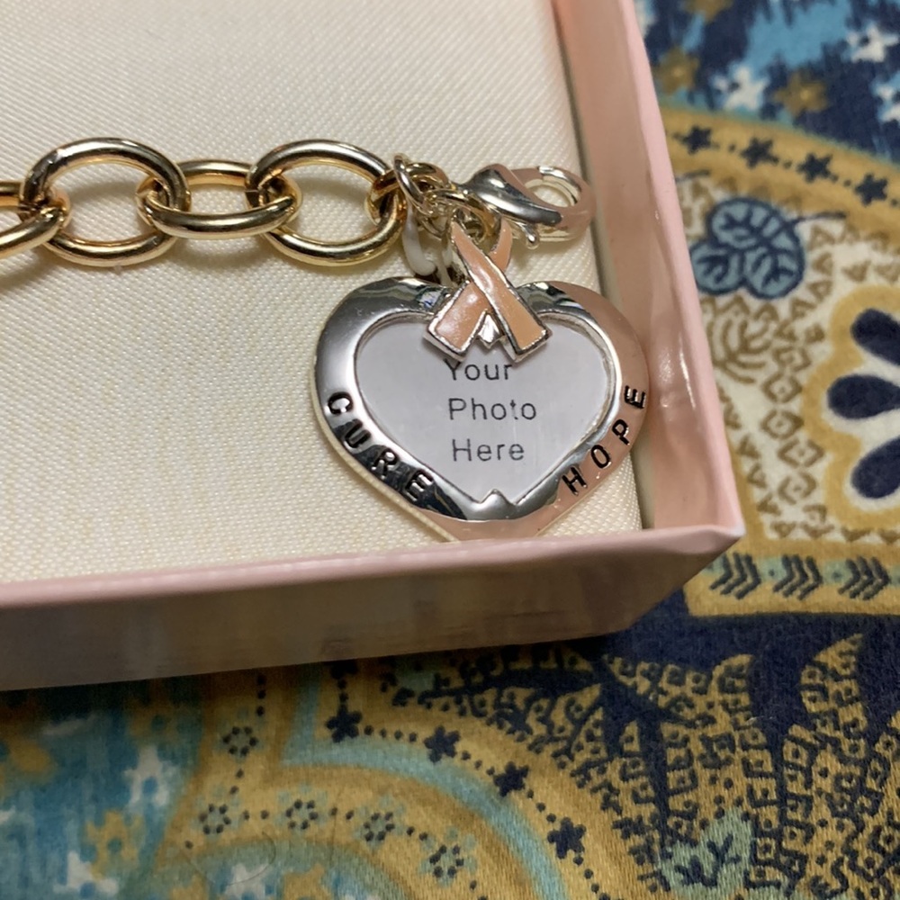 NWOT! Beautiful pink ribbon bracelet. With a picture locket